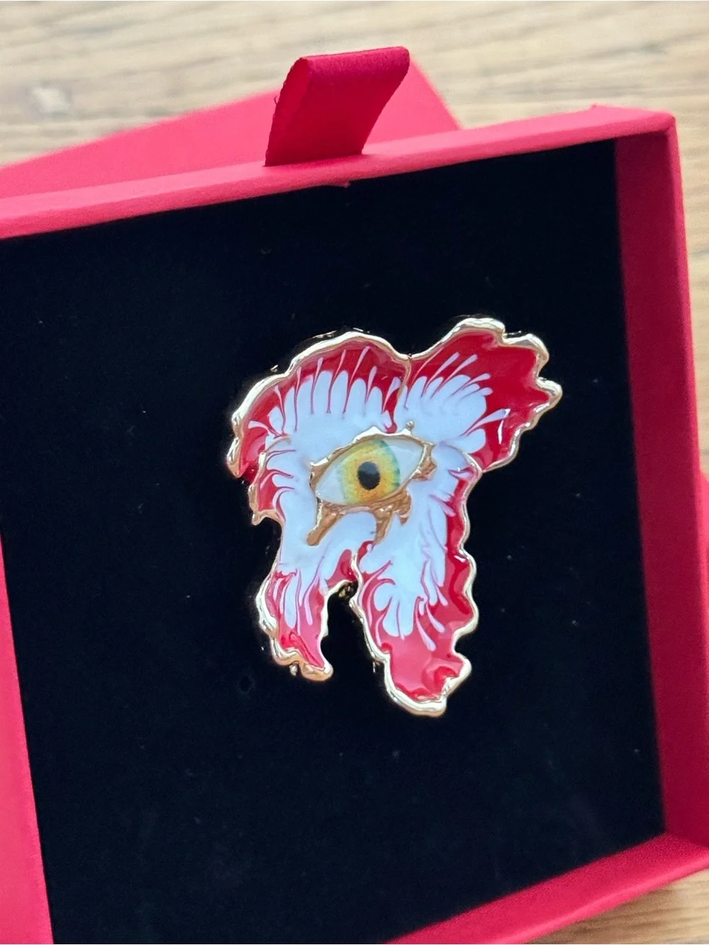 Uniqlo Red and White Enamel Eye Brooch with Gold Trim